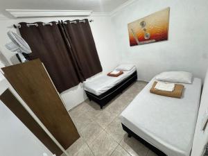 Ένα ή περισσότερα κρεβάτια σε δωμάτιο στο Casa de 2 andares no caiçara proximo ao Mineirão