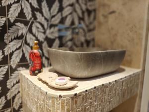 a bowl on top of a counter with a sink at Weranda in Bytom +9 photos