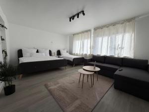 Postel nebo postele na pokoji v ubytování Cataleya Apartament