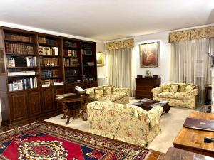 a living room with two couches and a table at Castello Vinci - Dimora di Charme in Vetralla