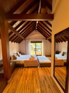 Postel nebo postele na pokoji v ubytování Pousada Ares da Serra - Centro