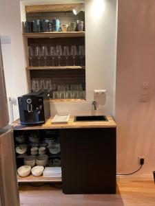 a kitchen with a counter with a coffee maker on it at EifelQuartier L9 in Schleiden