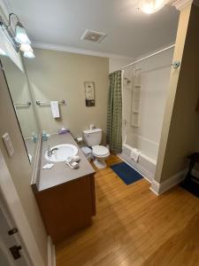 a bathroom with a sink and a toilet and a shower at Midstream Manor Unit 9 - 2 Bedroom Apartment in St. John's
