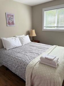 Postel nebo postele na pokoji v ubytování Vinnecomb Apartments - Ground Floor - 3 Bedroom