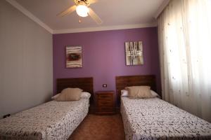 Łóżko lub łóżka w pokoju w obiekcie Villa Chayofa Sunrises