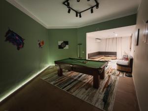 a living room with a pool table in it at Tahrir apartments in Cairo