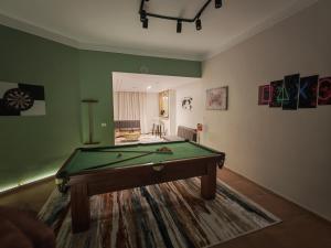 a living room with a pool table in it at Tahrir apartments in Cairo