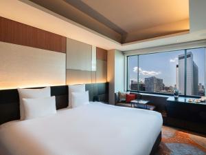 Postel nebo postele na pokoji v ubytování Pullman Tokyo Tamachi