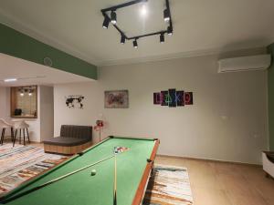 a living room with a pool table in it at Tahrir apartments in Cairo