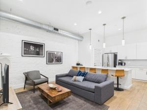 a living room with a couch and a table at The Saddlery-Setlist-4 Combo Unit-Walk to Broadway in Nashville