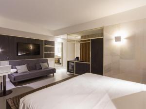 Postel nebo postele na pokoji v ubytování Novotel Salvador Rio Vermelho