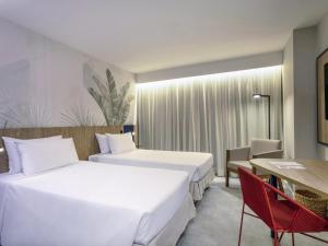 Postel nebo postele na pokoji v ubytování Novotel Salvador Rio Vermelho + 95 fotografií