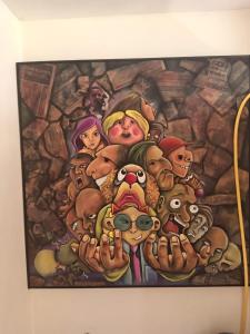 a painting of a group of people on a wall at Entire apartment in Ambato Ficoa in Ambato