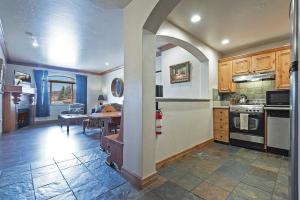 a kitchen with an archway in the middle of a room at Family Friendly Zermatt 2BR Villa Near Park City & Deer Valley Ski Resorts #55 57 in Mound City