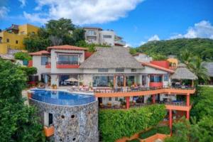 an aerial view of a house with a pool at Luxury Villa Paloma Blanca in Cruz de Huanacaxtle