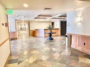 an empty lobby with a table in the middle at Family Friendly Zermatt 2BR Villa Near Park City & Deer Valley Ski Resorts #55 57 in Mound City +31 photos