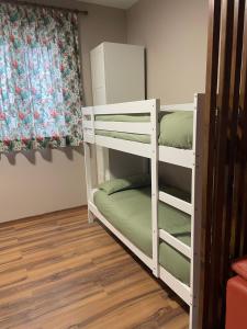 Μία ή περισσότερες κουκέτες σε δωμάτιο στο Villa Teresa