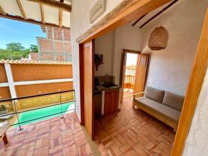 a living room with a couch and a balcony at Casa Mónica Barichara in Barichara +50 photos