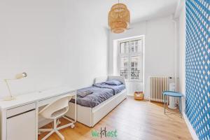 En eller flere senge i et værelse på COMM - Proudhon T5 - SC - Grand T5 lumineux au cœur de Besançon + 5 billeder