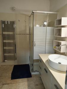 a bathroom with a sink and a shower at B&B Casa dolce casa in Cutrofiano