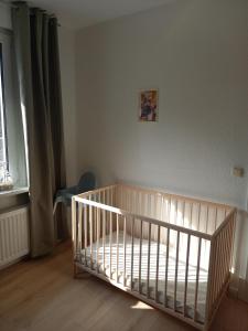 a nursery with a crib in a room at Ferienhaus Lukas in Zinnowitz