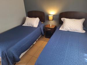 Ένα ή περισσότερα κρεβάτια σε δωμάτιο στο Casa Familiar La Rose