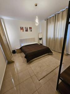 a bedroom with a large bed in a room at country side House in Irbid