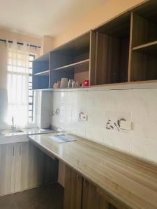 a kitchen with a counter top and a sink at A Oasis Taveta in Taveta