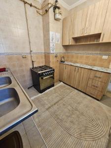 a kitchen with a sink and a stove at country side House in Irbid