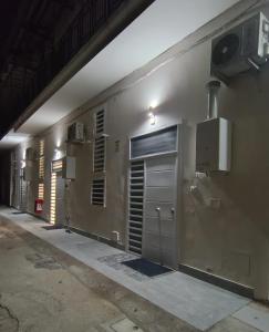 an empty building with a door and a window at AparthouseRisorgimento MISENO in Frattamaggiore +5 photos