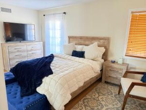 Ένα ή περισσότερα κρεβάτια σε δωμάτιο στο Les Délices Maison