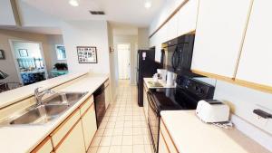 Kuchyň nebo kuchyňský kout v ubytování Club Villas Unit 11B