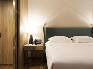 Postel nebo postele na pokoji v ubytování Fairmont Rio de Janeiro Copacabana