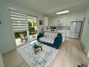 a living room with a couch and a table at Skana South in Delta