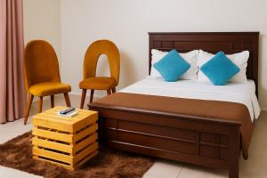 Ένα ή περισσότερα κρεβάτια σε δωμάτιο στο Noaz Hotel