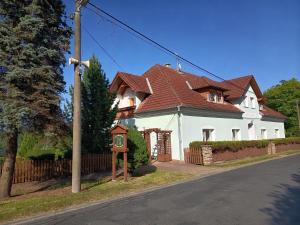 a large white house with a brown roof at Rezidence Jih in Hlavňovice +17 photos