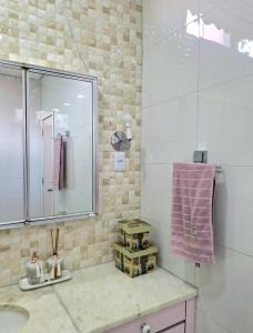 a bathroom with a sink and a shower at Pousada casa dos sonhos in São Gabriel