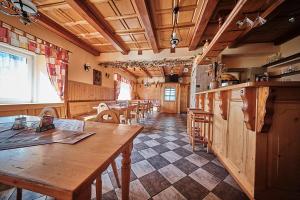 a dining room with a table and some chairs at Rezidence Jih in Hlavňovice