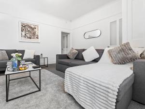 a living room with a couch and a table at Crew Quarters - Your Ideal Stay in Bury in Tottington +59 photos