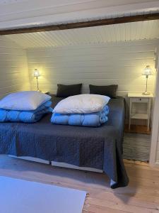 Voodi või voodid majutusasutuse Log Cabin On Fanø Near Beach And Nature toas