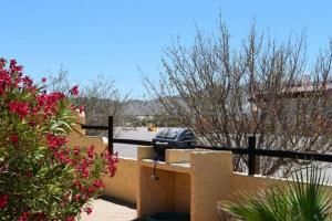 a car parked in a parking lot next to a fence at Los Sahuaros San Felipe Rental in Don Pancho