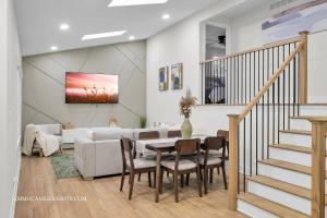 a living room with a table and a couch at Chicago Gem! Centrally Located - proximity to O' Hare Airport in Schaumburg +20 photos