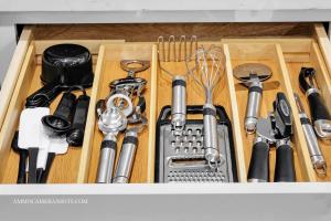 a drawer filled with lots of kitchen utensils at Chicago Gem! Centrally Located - proximity to O' Hare Airport in Schaumburg