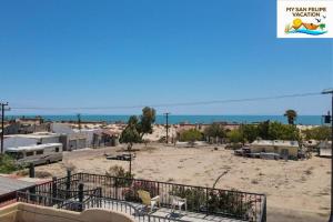 a view of a beach with houses and the ocean at Casa Sirena del Mar San Felipe Rental Home in San Felipe