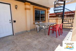 a patio with a table and chairs on a balcony at Casa Sirena del Mar San Felipe Rental Home in San Felipe
