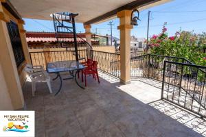 a patio with a table and chairs on a balcony at Casa Sirena del Mar San Felipe Rental Home in San Felipe +19 photos