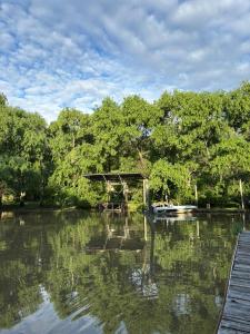 a bridge over a river with trees in the background at PATO NEGRO in Tigre +21 photos