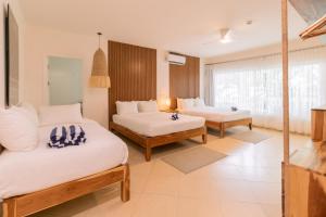 Ένα ή περισσότερα κρεβάτια σε δωμάτιο στο Hotel Santa Teresa by the Beach