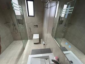 a bathroom with a shower and a sink and a toilet at قمرة قباء Quba moon5 in Al Madinah