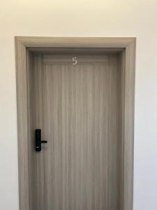 a close up of a door in a room at قمرة قباء Quba moon5 in Al Madinah